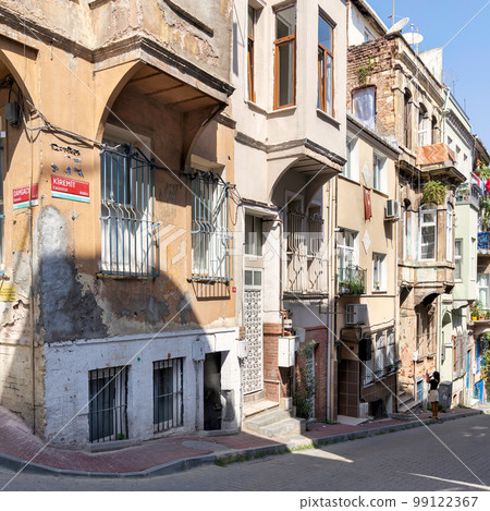 Cobblestone alley with beautiful old traditional houses in Balat district, on a summer day, Istanbul, Turkey Cobblestone alley with beautiful old traditional houses in Balat district, on a summer day, Istanbul, Turkey 99122367