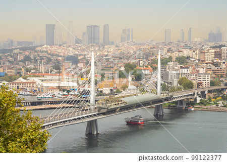 Aerial view of Golden Horn Metro Bridge, or Halic Metro Koprusu, before sunset, Istanbul, Turkey Aerial view of Golden Horn Metro Bridge, or Halic Metro Koprusu, before sunset, Istanbul, Turkey 99122377