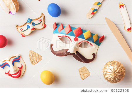 3D illustration of Purim celebration concept with Jewish carnival holiday over wooden white background. View from the top, flat lay. 3D illustration of Purim celebration concept with Jewish carnival holiday over wooden white background. View from the top, flat lay. 99122508