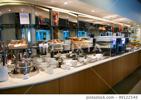 FRANKFURT, GERMANY - 11 NOV 2017: Buffet with hot and cold dishes in the airport frequent flyer business lounge at Frankfurt Airport FRANKFURT, GERMANY - 11 NOV 2017: Buffet with hot and cold dishes in the airport frequent flyer business lounge at Frankfurt Airport 99122548