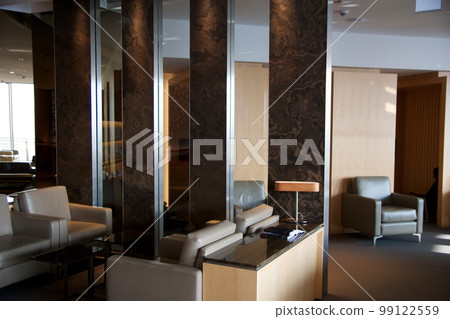FRANKFURT, GERMANY - 11 NOV 2017: Luxurious frequent flyer lounge at the international airport with comfortable armchairs FRANKFURT, GERMANY - 11 NOV 2017: Luxurious frequent flyer lounge at the international airport with comfortable armchairs 99122559