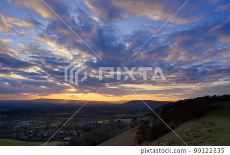 Classic sunset view from Colley Hill between Reigate and Dorking in Surrey, UK. Surrey Hills area of Outstanding Natural Beauty on the North Downs. Looking towards Leith Hill on the Greensand Ridge. 99122835