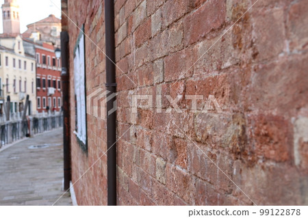 View of the Fondamenta Tolentino street in Venice, Italy. Street scene, old wall. 99122878