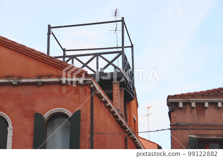 Roof with balcony on the top, window of the old house photo. Venetian architecture. Roof with balcony on the top, window of the old house photo. Venetian architecture. 99122882