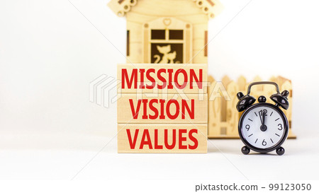 Mission vision values symbol. Concept words Mission Vision Values on wooden blocks on a beautiful white background. Black alarm clock, house model. Business mission vision values concept. Copy space. Mission vision values symbol. Concept words Mission Vision Values on wooden blocks on a beautiful white background. Black alarm clock, house model. Business mission vision values concept. Copy space. 99123050