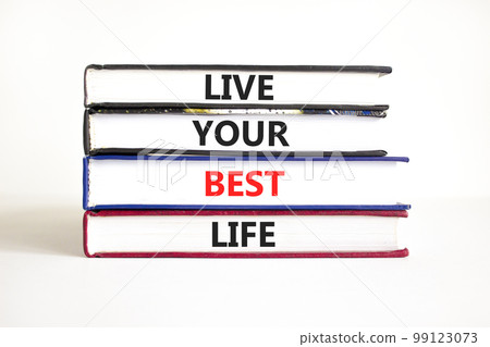 Live your best life symbol. Concept words Live your best life on books. Beautiful white table white background. Business live your best life concept. Copy space. 99123073