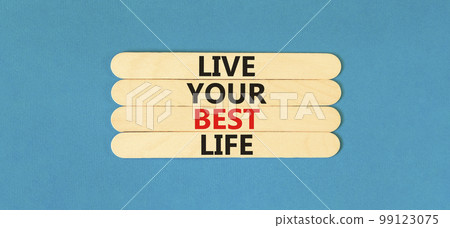 Live your best life symbol. Concept words Live your best life on wooden stick. Beautiful blue table blue background. Business live your best life concept. Copy space. Live your best life symbol. Concept words Live your best life on wooden stick. Beautiful blue table blue background. Business live your best life concept. Copy space. 99123075