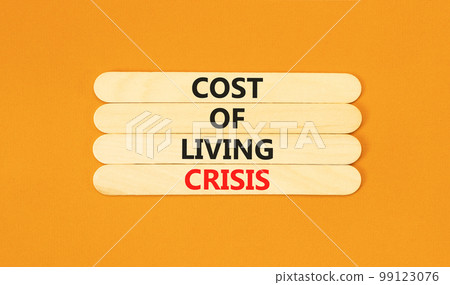 Cost of living crisis symbol. Concept words Cost of living crisis on wooden stick. Beautiful orange table orange background. Business cost of living crisis concept. Copy space. Cost of living crisis symbol. Concept words Cost of living crisis on wooden stick. Beautiful orange table orange background. Business cost of living crisis concept. Copy space. 99123076