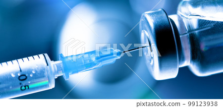 Medical syringe with a needle and a bollte with vaccine. 99123938