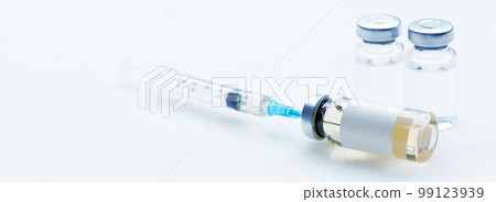 Medical syringe with a needle and a bollte with vaccine. 99123939