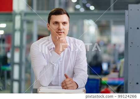 a man in a white shirt in the office. the portrait of an entrepreneur. a man in a white shirt in the office. the portrait of an entrepreneur. 99124266