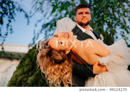 close up. dancing happy bride and groom in nature. close up. dancing happy bride and groom in nature. 99124270
