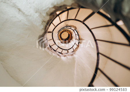 Beautiful spiral staircases. Under the stairs view Beautiful spiral staircases. Under the stairs view 99124583