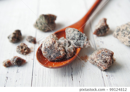 Himalayan black salt rock crystals, Kala Namak in a container on table Himalayan black salt rock crystals, Kala Namak in a container on table 99124812