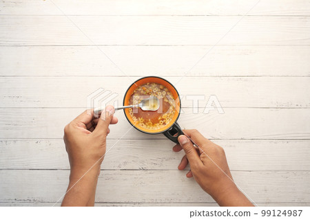 instant cup soup in a mug on table  99124987