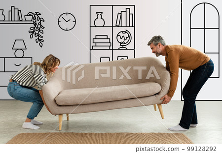 Happy Couple Putting Sofa Together After Renovation At Home Happy Couple Putting Sofa Together After Renovation At Home 99128292