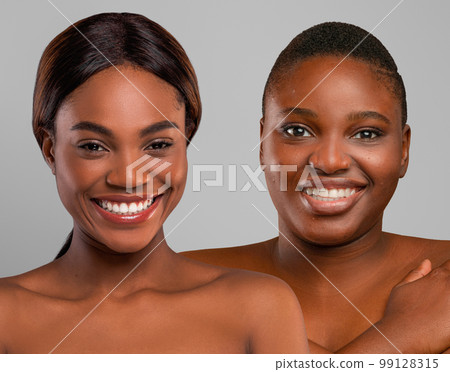 Cheerful slim and plus size ladies posing naked on grey 99128315