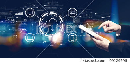 Cloud computing with businessman using a tablet computer Cloud computing with businessman using a tablet computer 99129596