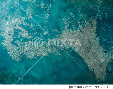 Ocean water and plastic trash island. Aerial view of pollution by rubbish 99129919