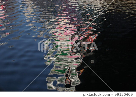 Colorful night neon art on the swaying water surface 2 99130409