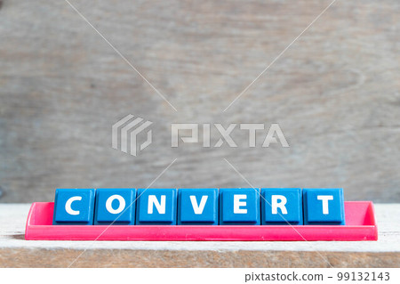 Tile alphabet letter with wordconvert in red color rack on wood background Tile alphabet letter with wordconvert in red color rack on wood background 99132143