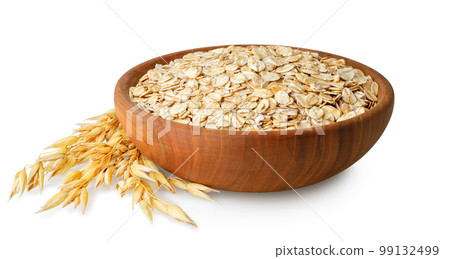 oatmeal in bowl and oat ears near isolated on white background oatmeal in bowl and oat ears near isolated on white background 99132499