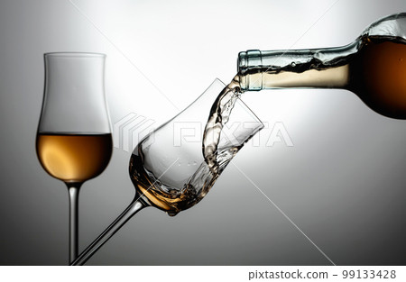 Glasses of premium alcohol. 99133428