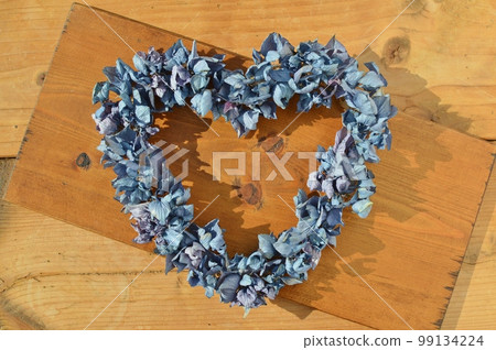 Heart wreath made from dried hydrangea flowers Heart wreath made from dried hydrangea flowers 99134224