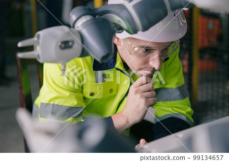 Automation Engineer Service Programming Robotic Arm. New Era Modern Machine Automatic Manufacturing Industry Concept. 99134657