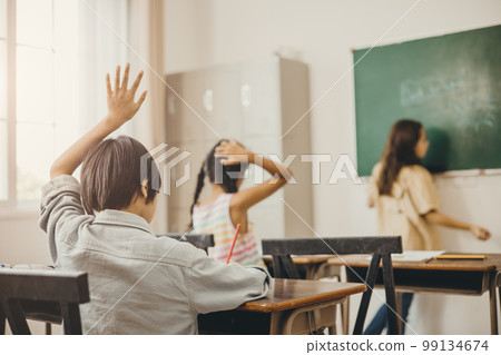 kids education in the school class room. boy hand rise for asking teacher problem kids education in the school class room. boy hand rise for asking teacher problem 99134674