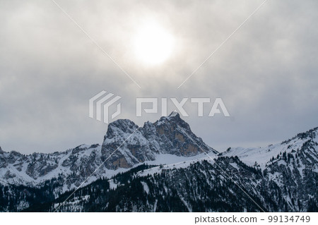 Fuessen, Germany - January 14th 2023 - The famous Aggenstein mountain in winter under the shining sun Fuessen, Germany - January 14th 2023 - The famous Aggenstein mountain in winter under the shining sun 99134749