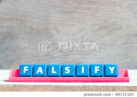 Tile alphabet letter with word falsify in red color rack on wood background Tile alphabet letter with word falsify in red color rack on wood background 99135165