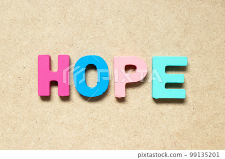 Color alphabet letter in word hope on wood background 99135201