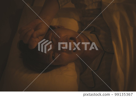 Bedroom and man in his 40s Bedroom and man in his 40s 99135367