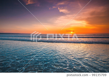 Beach sunset over the tropical sea 99135709