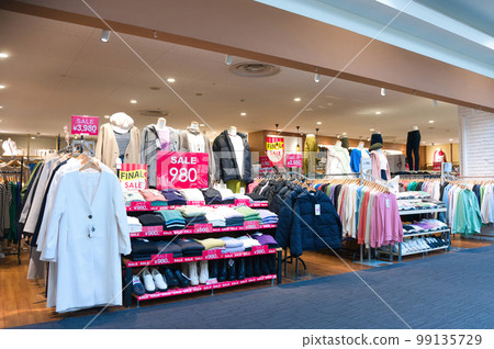 Fashionable clothing store in a shopping center Fashionable clothing store in a shopping center 99135729