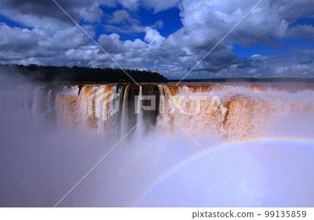 Rainbow over Iguazu Falls from the Argentinian side 99135859