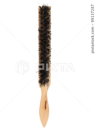 Brush for cleaning the surface with a wooden handle isolated on white background. Construction tool. Brush for cleaning the surface with a wooden handle isolated on white background. Construction tool. 99137287