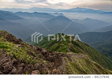 Joshu Hotaka mountain range and Oze mountain range in the morning mist seen from Mt. Tanigawa and Nishiguro ridge 99137646