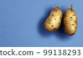 Potatoes with light blue background 99138293