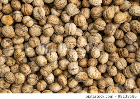 Natural walnut background texture Abstract walnuts. Harvest, agriculture 99138586