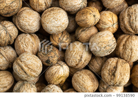 Background of fresh walnuts, vegetable protein for vegetarianism and raw food. The concept is healthy eating. 99138590