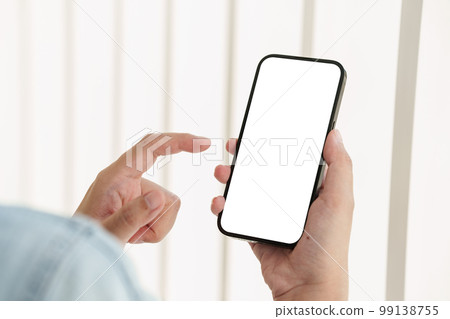Close up of Man holding mobile phone with white background. Close up of Man holding mobile phone with white background. 99138755