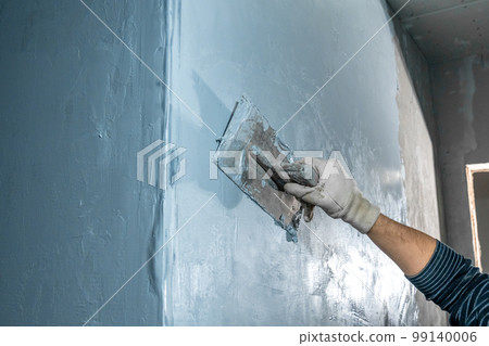 manual adjustment of wall plaster with trowel 99140006