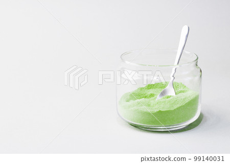 Green tea matcha in a glass jar. Matcha ginger latte. Rich source of antioxidants and polyphenols. Green tea matcha in a glass jar. Matcha ginger latte. Rich source of antioxidants and polyphenols. 99140031