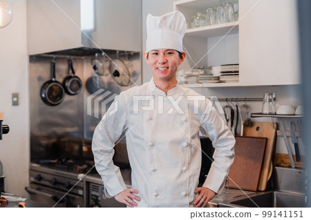 Male chef working with a smile 99141151
