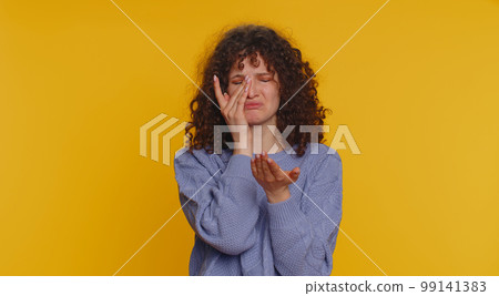 Upset disappointed woman wipes tears and cries from despair, being sad because of unfair things loss Upset disappointed woman wipes tears and cries from despair, being sad because of unfair things loss 99141383