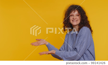 Woman pointing empty place, advertising area for commercial text, copy space for goods promotion Woman pointing empty place, advertising area for commercial text, copy space for goods promotion 99141426