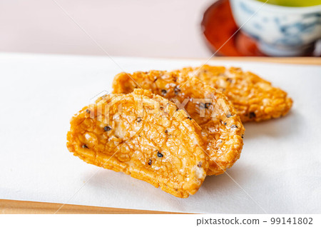 Sesame fried rice crackers and Japanese tea 99141802