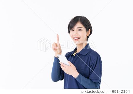 Care worker looking at smartphone 99142304